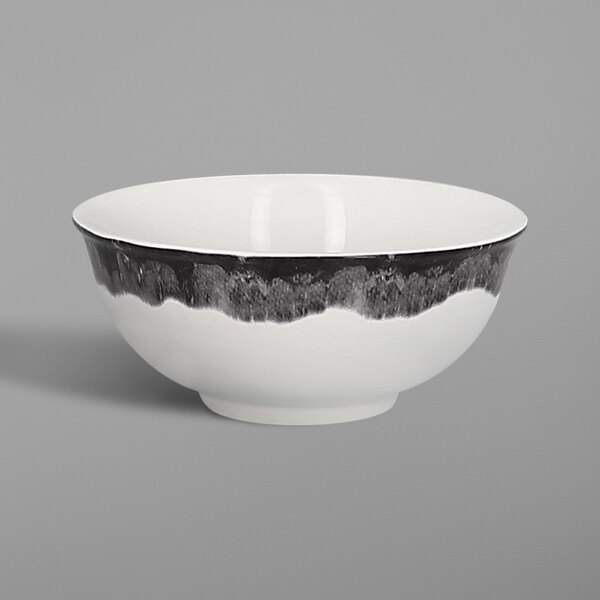 A white RAK Porcelain bowl with black lines on it.