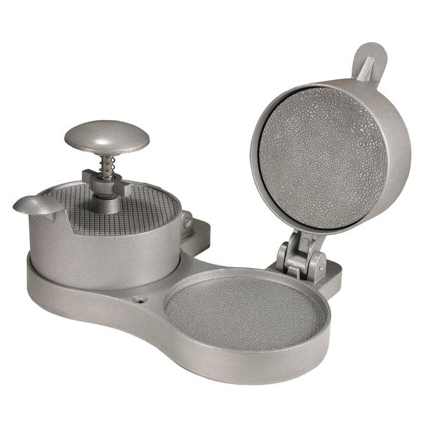 A silver metal Weston double adjustable hamburger press with a lid.