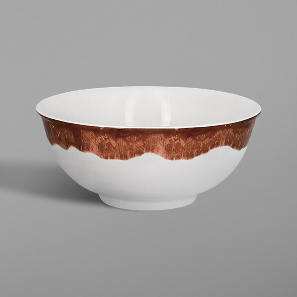 A white RAK Porcelain Woodart bowl with a brown stripe on the rim.