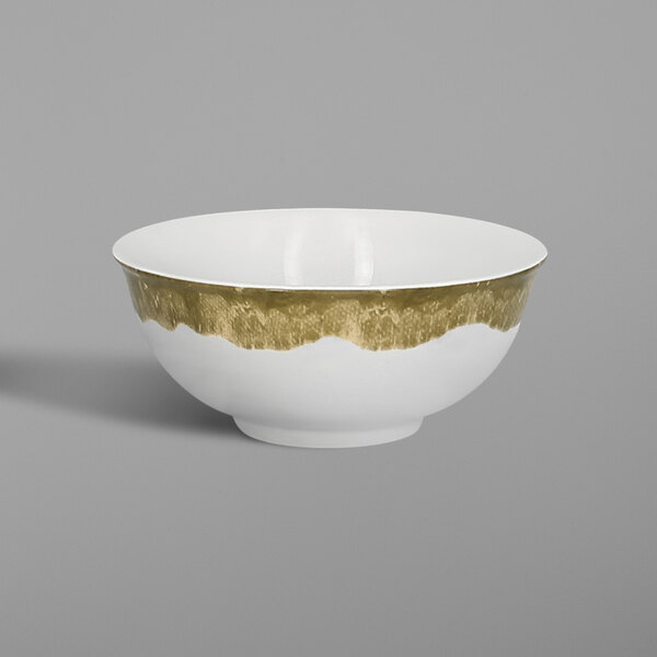A white porcelain bowl with a moss green interior and a gold band.