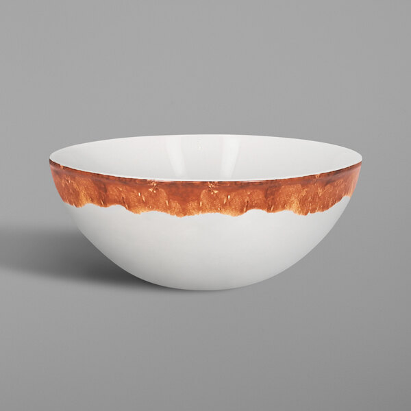 A white RAK Porcelain bowl with brown wood design on the rim.