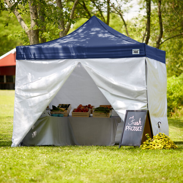 A navy Backyard Pro instant canopy with blue fabric walls.
