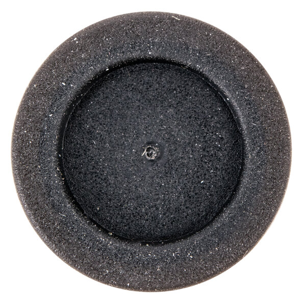 A black circle with a hole in it.