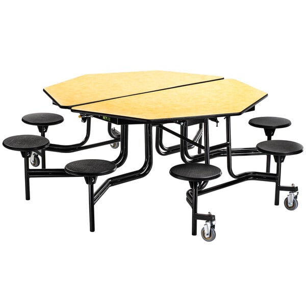 A black round National Public Seating cafeteria table with a chrome frame and wheels with eight black round stools with a metal frame.