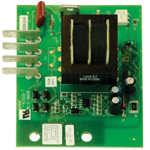 A green Bunn liquid level control board with black and brown components.