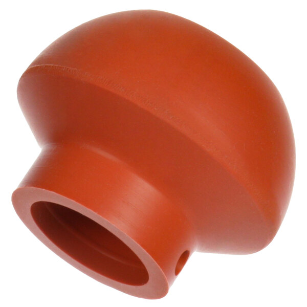 A round orange plastic stopper with a hole in the middle.