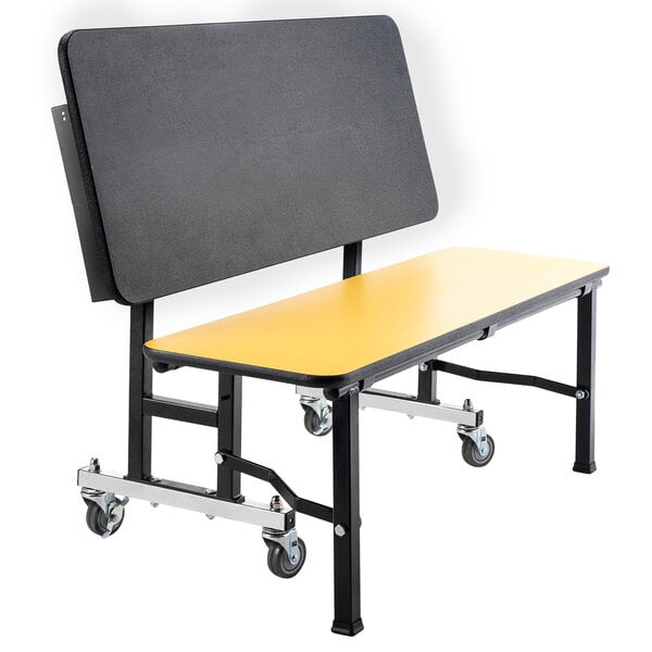 A yellow and black National Public Seating ToGo mobile bench with wheels.
