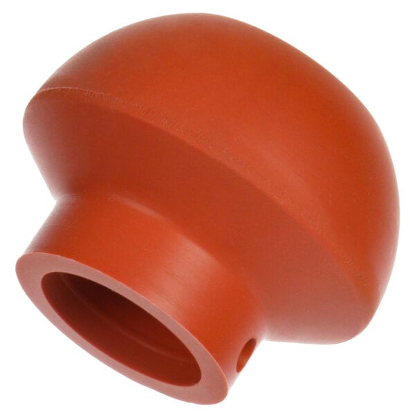 An orange plastic Noble Warewashing stopper with a hole in the middle.