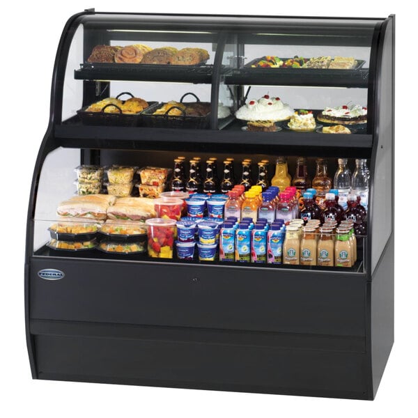 A Federal Industries SSRC-5052 dual service dual temperature display case with food and drinks on it.