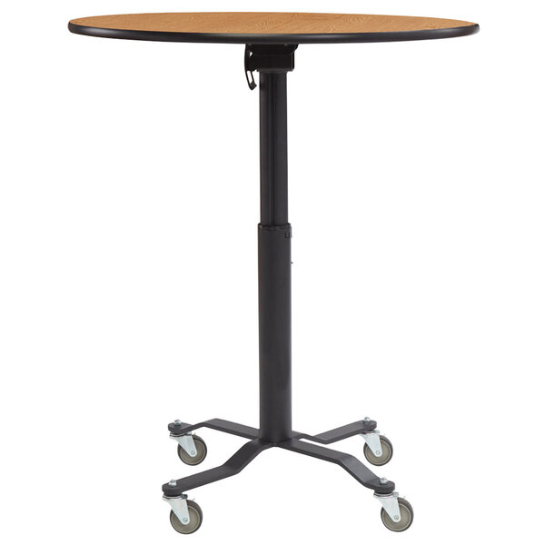 A brown round National Public Seating Cafe Time II table with black wheels.