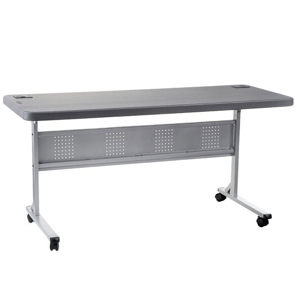 A grey rectangular table with wheels.