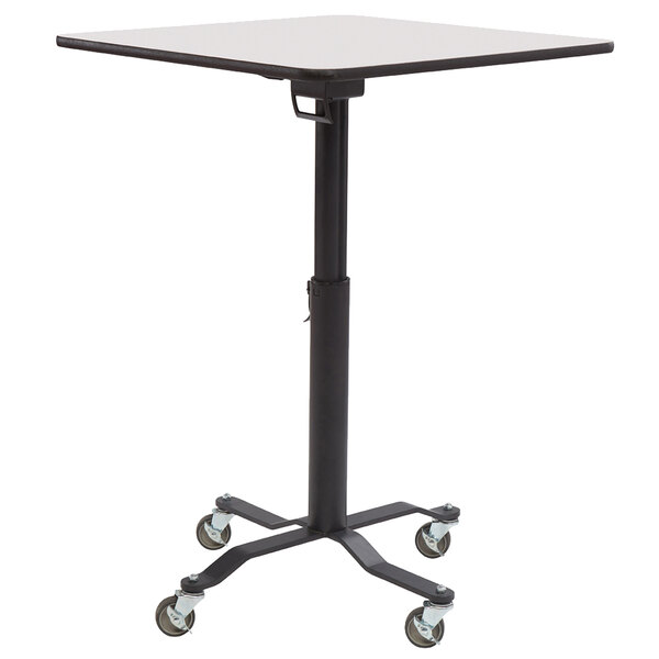 A black and white National Public Seating Cafe Time II mobile table with wheels.
