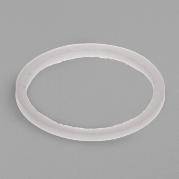 A white oval washer with a hole in it.