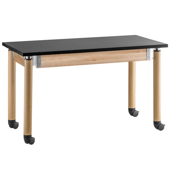 A black National Public Seating science lab table with oak legs and wheels.