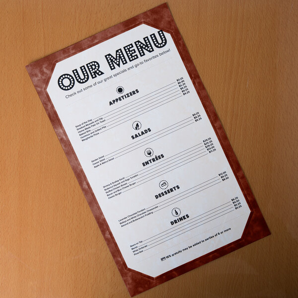 A brown menu with a marble border on a table.