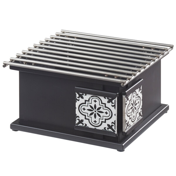 A black and white rectangular object with metal rods on a counter.