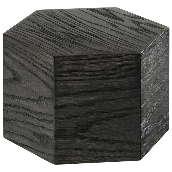 A black hexagon shaped oak wood riser.