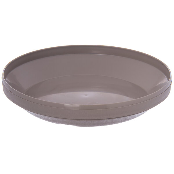 A grey plastic Dinex underliner for a latte pellet bowl on a white surface.
