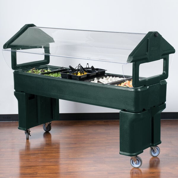 A Forest Green Carlisle Six Star Portable Food / Salad Bar on a table with a clear cover.