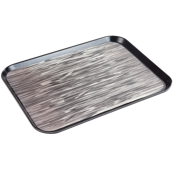 A black rectangular tray with a wood pattern on it.