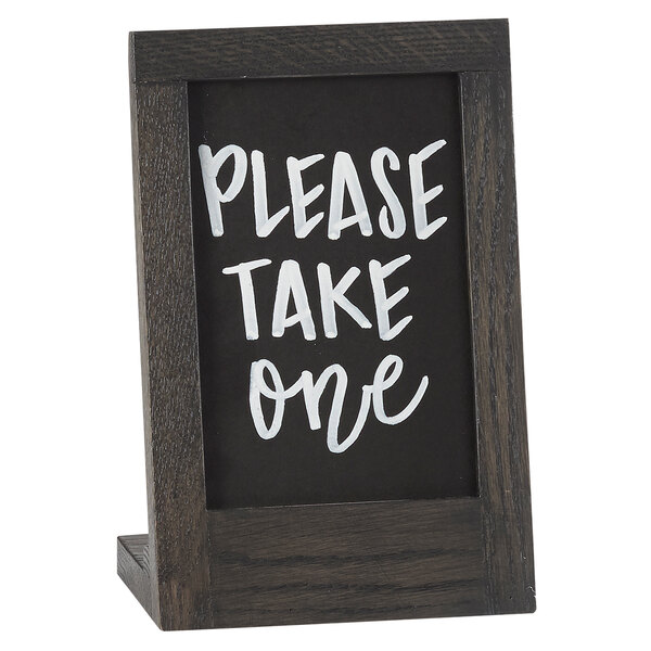A black Cal-Mil chalkboard stand with white text on it.