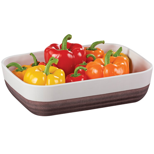 A Cal-Mil white melamine platter with red and yellow bell peppers.