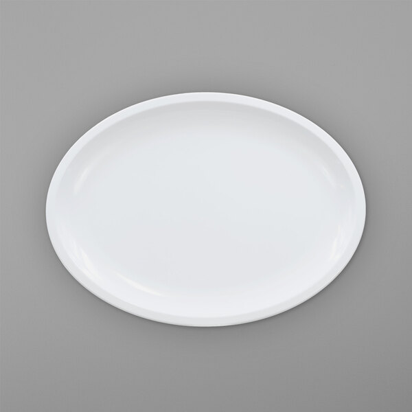 An Elite Global Solutions white oval melamine platter on a gray surface.