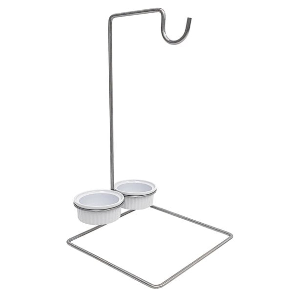 A metal stand with two bowls on it.