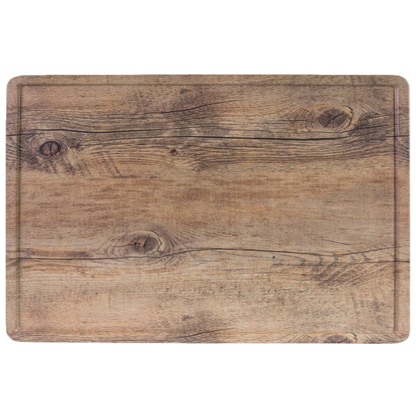 An Elite Global Solutions faux driftwood melamine serving board with a wood surface.