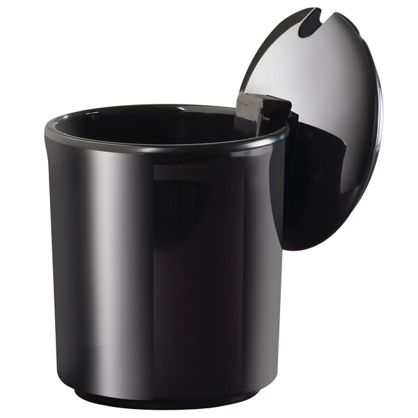 A black notched lid on a black Cal-Mil jar on a counter.