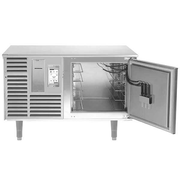 A Traulsen silver undercounter blast chiller with a right hinged door open.