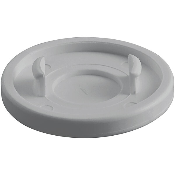 A white plastic lid with two holes and a handle.