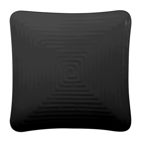A black square melamine plate with a spiral pattern.
