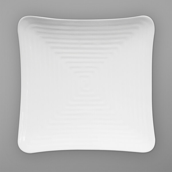 A white square Elite Global Solutions melamine plate with a curved wavy design.