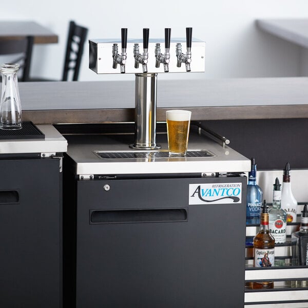 An Avantco black beer dispenser on a counter with two beer taps.