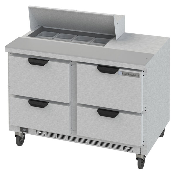 A stainless steel Beverage-Air refrigerated sandwich prep table with four drawers.