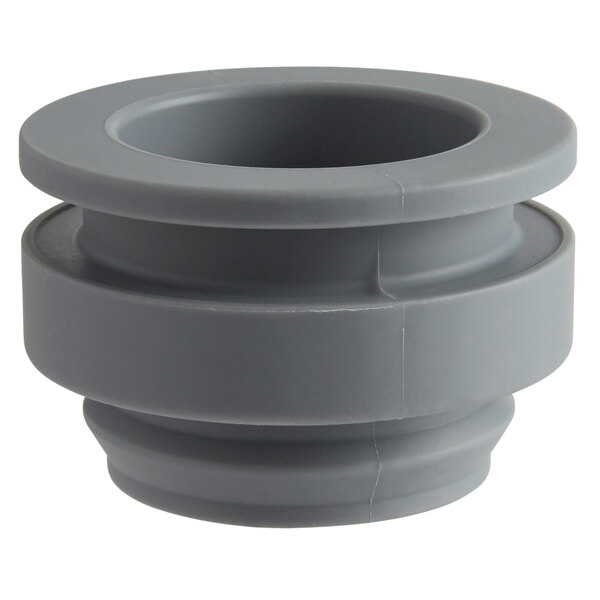A gray plastic Robot Coupe lid guide with a hole.