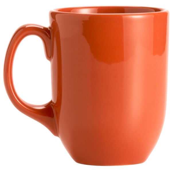 A Libbey Cayenne porcelain coffee mug with a handle in orange.