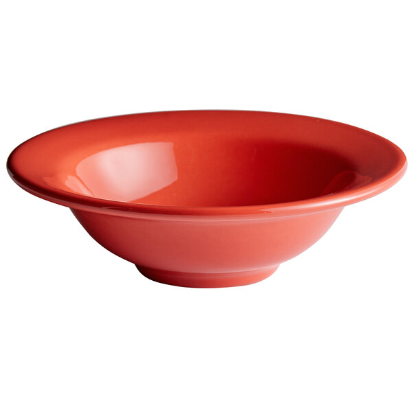 A white porcelain bowl with a red rim.