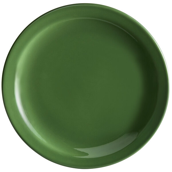 A green porcelain plate with a white circle in the center.