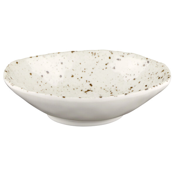 A white oval melamine bowl with brown speckled spots.