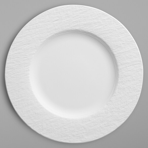 A white Villeroy & Boch porcelain plate with a circular design on the rim.