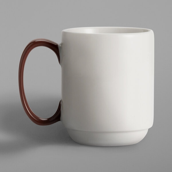 A Libbey white porcelain mug with a brown handle.