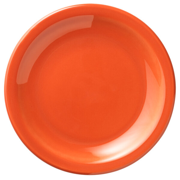 A close-up of a Libbey Cayenne porcelain plate with an orange background.
