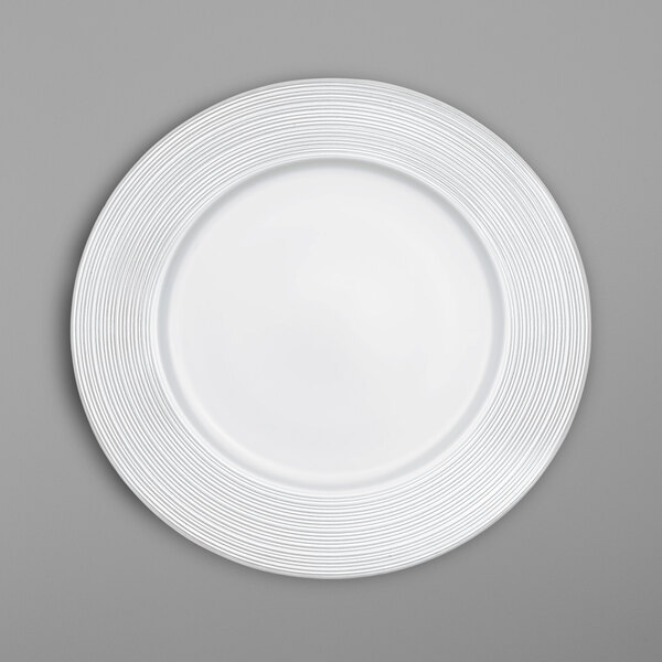 A white Villeroy & Boch bone porcelain plate with a swirl pattern.