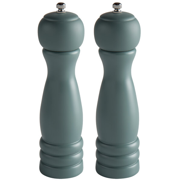 Two grey wooden salt and pepper mills with silver tops.