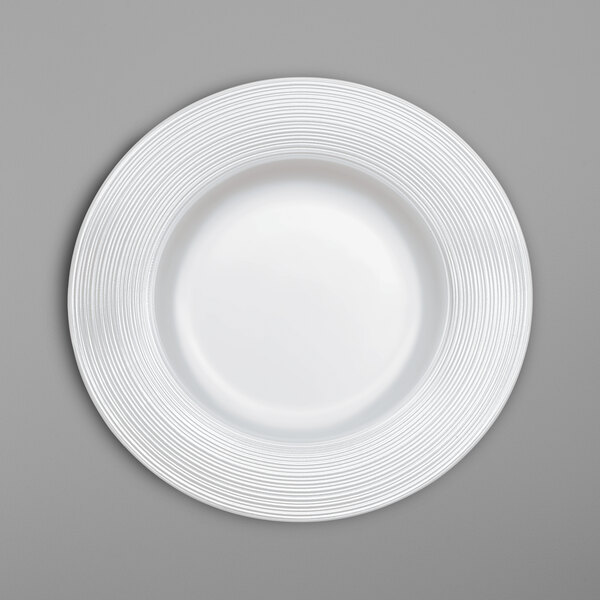 A white Villeroy & Boch bone porcelain plate with spiral lines on the rim.