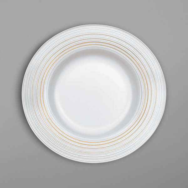 A white Villeroy & Boch porcelain plate with gold lines.