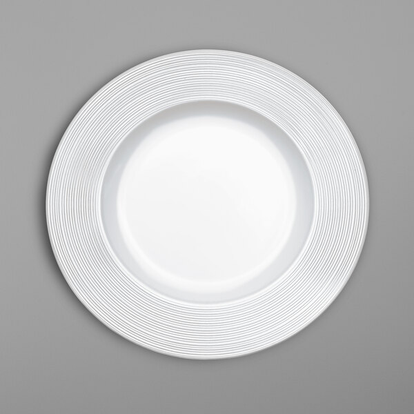 A white Villeroy & Boch bone porcelain plate with a swirl pattern on the rim.