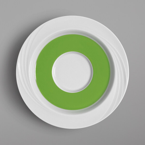A white saucer with a white rim and light green center.